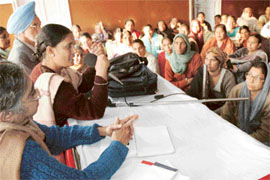 Anganwadi workers hold a meeting at Saini Bhavan in Chandigarh on Saturday. 