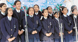 Children take part in carol singing in Chandigarh Baptist School in Sector 45, Chandigarh on Saturday.