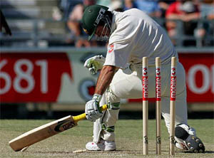 Australian captain Ricky Ponting makes an unsuccessful attempt to get back into his crease on the third day of the first Test match against Pakistan in Perth on Saturday. Ponting was stumped by wicketkeeper Kamran Akmal off the bowling of Danish Kaneria for 98. 