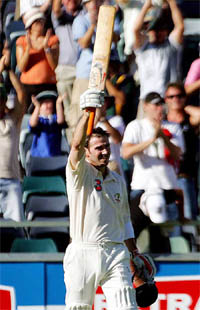 Australias Damien Martyn celebrates on completing his century on the third day of the first Test against Pakistan at the WACA ground in Perth on Saturday. 