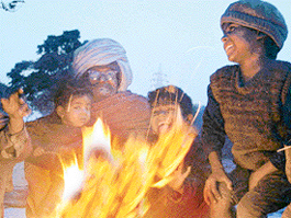 Far away from home, these migrants from Rajasthan derive warmth from togetherness, as winds create a chilling effect in Chandigarh on Sunday.