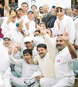 Amar Ujala team, winners of the Hutch-Chandigarh Press Club Inter-Media Cricket Tournament, with Senior Associate Editor of The Tribune A.J. Philip at the PCA stadium in Mohali on Sunday.