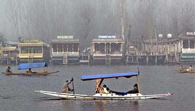 Tourists enjoy Shikara ride at Dal Lake