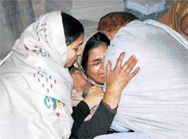 Relatives of Mohan Lal, who was killed by dacoits near Tibba Road in Ludhiana on Sunday