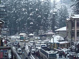 Traffic makes its way on the Mall Road in Manali after Sunday nights snowfall.