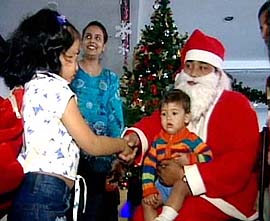 Santa Claus plays with children in Kolkata. The West Bengal capital is all set to celebrate Christmas with gusto. The citys shopping malls have been decorated with bells, balloons and ribbons.