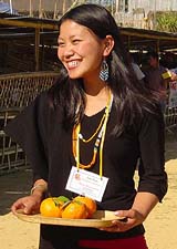 A young Zelianrong tribal girl receiving visitors