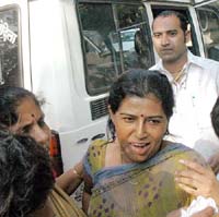 Asha, wife of underworld gangster Arun Gawli, booked for assaulting two women, is brought to the Mazgaon court in Mumbai on Monday.
