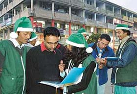 Green Santas from Greenpeace during a campaign against genetically engineered crops at Sector 17 in Chandigarh