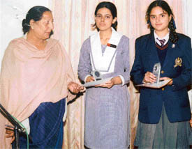Ms Bakhshi, Director of Sant Kirpal Singh Seva Panthi Public School, Neelon, with Sahilpreet Kaur, who stood first, and Champanpreet Kaur, who stood second