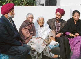 Nanak Singhs ailing wife with other members of the family