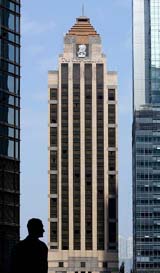 A man stands in front of the Ritz-Carlton hotel in Hong Kong on Wednesday.