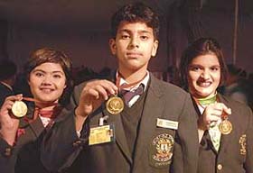 From left: Tanisha Raizada, Tejeshwar Singh and Staffy Bhateja, students of DPS, who won gold medals at the prize distribution function