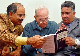 City-based advocates Ranjit and Anil Malhotra with Brother R.I. Meredith during the release of their book in Chandigarh