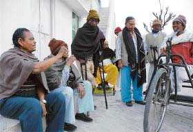 Krishna (extreme left) shares a point with fellow inmates of Kusht Ashram for leprosy patients in Chandigarh