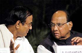 Union Finance Minister P. Chidambaram and Union Agriculture Minister Sharad Pawar have a word at the 70th annual general meeting of the Indian Sugar Mills Association in New Delhi