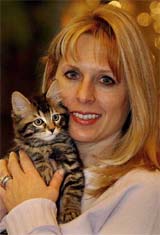Julie holds her nine-week-old cat, Little Nicky, on Wednesday in Texas. Little Nicky, a successfully cloned cat, was sold to Julie by Genetic Savings and Clone for $ 50,000