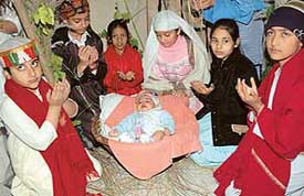 Students of Guru Nanak Public School (Junior Wing), Sector 37, participate in a Christmas function held on the school premises in Chandigarh on Thursday.