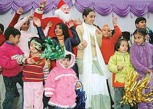 Students of Sanjay Public Senior Secondary School, Sector 44, celebrate Christmas on the school premises in Chandigarh on Thursday.
