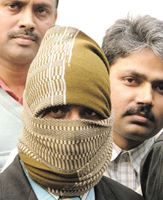 The masked intruder who struck in the South Avenue residence of an MP in the Capital recently.