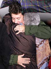 French journalist Christian Chesnot hugs his mother Denise moments after landing at Villacoublay military airbase, near Paris, on Wednesday. Chesnot and collegue Georges Malbrunot were released by their captors in Baghdad after being held hostage for more than four months