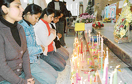 Devotees pray on the occasion of Christmas at the Christ King Cathedral Church