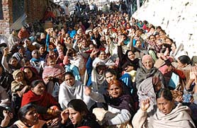 Residents of Krishnanagar protest against the demolition drive by the Shimla Municipal Corporation to remove unauthorised structures.