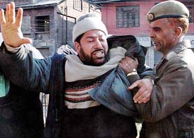 A Muslim League activist being taken into preventive custody during a demonstration by a separatist organisation in Srinagar on Saturday.