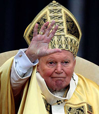 Pope John Paul II blesses the faithful gathered at St Peter's Square during his message after the Christmas mass in Vatican City on Saturday.