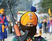 A little nihang: Four-year-old Bhupinder Singh carries a toy gun