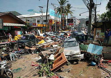 A street is littered with damaged vehicles and debris after the area was hit by tidal waves at Patong beach in Phuket, Thailand, on December 26. The most powerful earthquake in 40 years triggered massive tidal waves that slammed to coastlines across Asia on Sunday, killing more than 9,000 in Sri Lanka, Indonesia, India, Malaysia and Thailand. The U.S. Geological Survey said the 8.9-magnitude earthquake in Indonesia is the largest in the world in 40 years.  AP/PTI