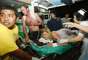 An injured foreign tourist is sent to a hospital after a tsunami hit Phuket, about 862 km south of Bangkok on December 26.  Reuters