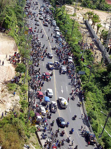 A view from a helicopter of people in Phuket, about 862 km south of Bangkok, after a tsunami hit the island on December 26. Thailand has also ordered the evacuation of areas hit by the tsunami wave in three southern provinces, including Phuket.  Reuters