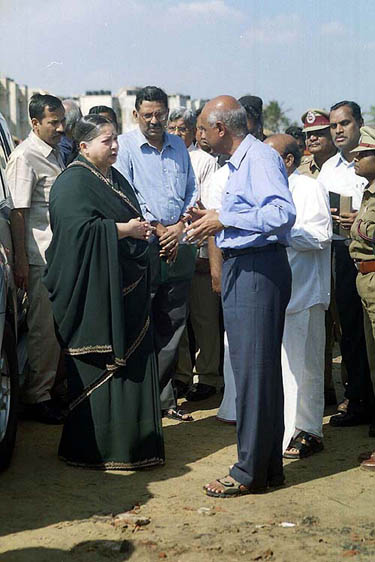 Tamil Nadu Chief Minister Jayalalithaa talks to the officials about the restoration works at Marina beach in Chennai on Sunday after tidal waves hit the Tamil Nadu coastal areas.  PTI