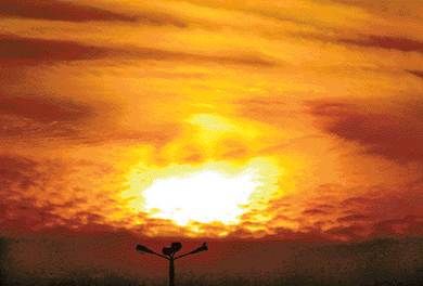 Setting suns struggle to peep from behind a curtain of cloud gave rise to a riot of colours in the sky in Chandigarh 