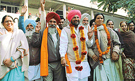 Mr Mohinder Singh, who has been made acting Chairman of the Panchayat Samiti, comes out of the DCs office along with his supporters in Chandigarh on Monday.