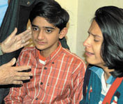 The lucky survivor, a 13-year-old, was away for the night when the assailant struck.