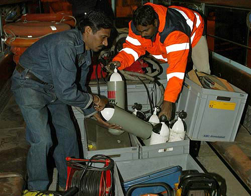 Members of a disaster management team from Gujarat load life-saving equipment on a vehicle bound for the south India, in Ahmedabad late on December 26. India's weather bureau on Monday warned that more tsunamis could strike the coast over the next couple of days, but said those would be smaller than the giant tidal wave triggered by an earthquake that killed thousands across Asia.  Reuters