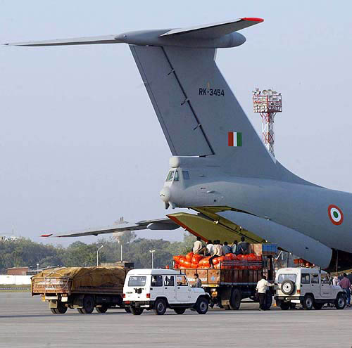Relief material being loaded in an IAF aircraft in Ahmedabad airport on Monday for the victims of the tidal waves.  PTI