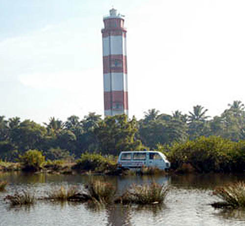 This ambulance was tossed into a bush in the coastal area of Puthvype near Kochi by the huge tidal waves triggered be an earthquake that originated in Indonesia. In the background is the lighthouse of Vyin Island.  PTI