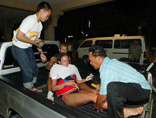 Two injured foreign tourists are sent to a hospital after a tsunami hit Phuket, about 862 km south of Bangkok, on December 26.  Reuters