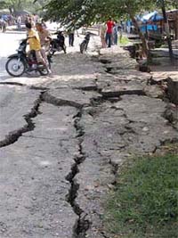A road damaged by a powerful earthquake in Lhokseumawe in northern Sumatra's Aceh province