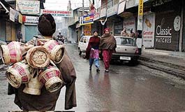 A kangri seller looks for customers in Srinagar on Tuesday as the Kashmir Traders Federation gave a strike call against power curtailment in the valley.