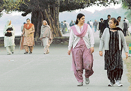  People take a walk at Sukhna Lake in the evening.