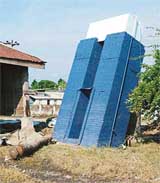 A water tank seen damaged in the Port Blair area after tidal waves hit the coastline of Andaman and Nicobar islands on Sunday. 
