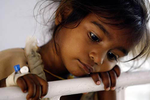 Kamalvathi, a survivor of Sunday's devastating tsunami, undergoes treatment in Cuddalore, 180 km south of Chennai.  Reuters