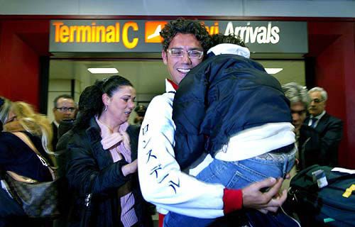 Italian tourists coming back from Thai island Phuket hug their relatives after their arrival at Rome's Fiumicino international airport on December 28. Hopes faded on Tuesday for tourists missing in some of Asia's most popular resorts, two days after a tsunami triggered by an earthquake battered Indian Ocean coastlines.  Reuters