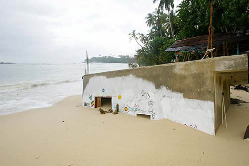 A beachfront shop is submerged in sand in Unawatuna, in southern Sri Lanka, on December 28, 2004. Nations on the Indian Ocean from Indonesia to Sri Lanka struggled on Tuesday to find and bury their dead and help the survivors of quake-triggered tidal waves.  Reuters