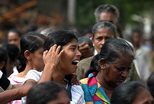 Banti Fernando, a 14-year-old Sri Lankan girl, mourns the death of her mother in Koralawella, south of Colombo, on December 28. Her mother was killed when a tsunami hit the area on Sunday.  Reuters