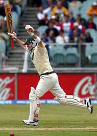 Australias Damien Martyn celebrates as he takes a quick single to bring up his century during the third day of the second Test in Melbourne 